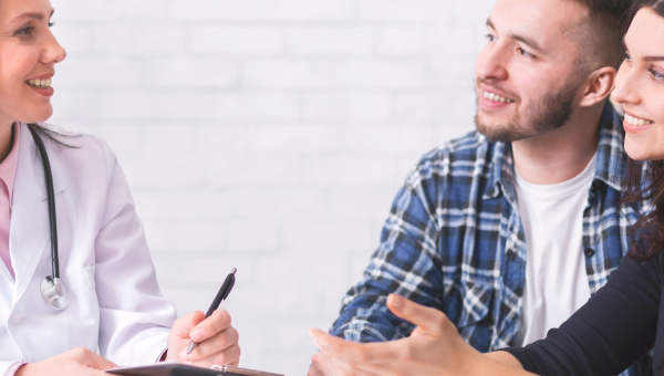 A couple talking to a the Woodlands IVF specialist